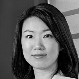 black and white headshot of Tracy Dong